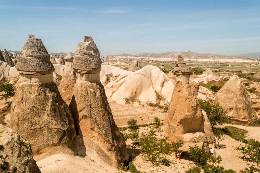 view of stone formations in valley and mountains cappadocia turkey 1024x681