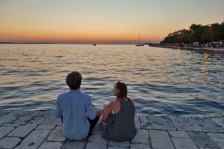 A Couple enjoying the view of sunset