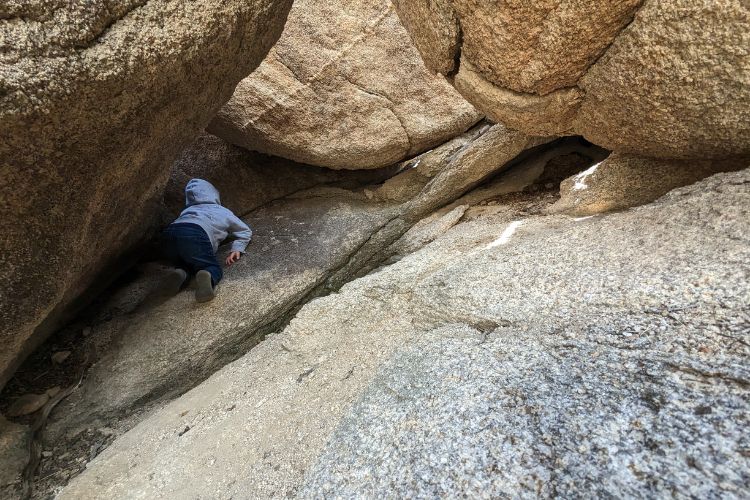 Child climbing on Barker Dam Trail