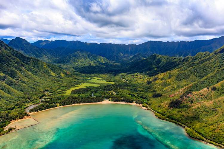 View of Oahu coastline and mountains in Honolulu Hawaii from a helicopter